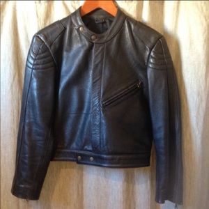 Dark black/brow leather jacket.